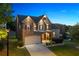 Charming two-story home with a stone facade, well-manicured lawn, and a two-car garage at 3755 Lake Haven Way, Atlanta, GA 30349