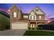 Charming two-story home with brick accents, well-kept lawn, and a two-car garage at 3755 Lake Haven Way, Atlanta, GA 30349