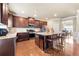 Modern kitchen features dark wood cabinets, granite countertops, and stainless steel appliances at 3755 Lake Haven Way, Atlanta, GA 30349