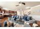 Cozy living room with a large sofa, throw pillows, and an adjacent kitchen with a breakfast bar at 3755 Lake Haven Way, Atlanta, GA 30349