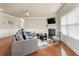 Comfortable living room with hardwood floors, a fireplace, and plenty of natural light at 3755 Lake Haven Way, Atlanta, GA 30349