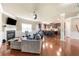 Open concept living room with fireplace, large window, and an eat-in kitchen with barstool seating at 3755 Lake Haven Way, Atlanta, GA 30349