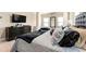 Comfortable main bedroom with a large bed, dresser, dark wood furniture and neutral colored walls at 3755 Lake Haven Way, Atlanta, GA 30349