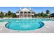 Large outdoor swimming pool with comfortable lounge chairs and community clubhouse. Perfect for relaxing at 3755 Lake Haven Way, Atlanta, GA 30349