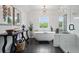 Stylish bathroom with freestanding tub, shower with glass door and modern lighting at 572 Cresentry Brk, Smyrna, GA 30082