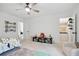 Spacious bedroom with walk-in closet, dinosaur accents, and cozy seating area at 572 Cresentry Brk, Smyrna, GA 30082