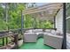Inviting outdoor deck with pergola, stylish wicker seating, and lush green surroundings at 572 Cresentry Brk, Smyrna, GA 30082