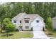 Beautiful two-story home with a brick and siding exterior, complemented by a well-manicured lawn and mature trees at 572 Cresentry Brk, Smyrna, GA 30082