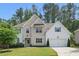 Charming two-story home with a well-manicured lawn, beautiful landscaping, and a welcoming entrance at 572 Cresentry Brk, Smyrna, GA 30082