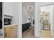 Hallway with modern cabinetry, wooden floors, leading to a well-organized pantry at 572 Cresentry Brk, Smyrna, GA 30082