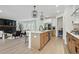 Gourmet kitchen seamlessly connects to living area, boasting stainless steel appliances and modern finishes at 572 Cresentry Brk, Smyrna, GA 30082