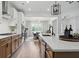Modern kitchen with stainless steel appliances, stone countertops, and open layout to dining area at 572 Cresentry Brk, Smyrna, GA 30082