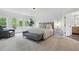 Spacious main bedroom featuring a sitting area and ensuite bathroom with natural light at 572 Cresentry Brk, Smyrna, GA 30082