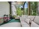 Relaxing covered patio with plush seating, perfect for enjoying the outdoors in comfort and style at 572 Cresentry Brk, Smyrna, GA 30082