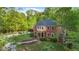Attractive two-story brick home featuring well-maintained landscaping and mature trees in a serene setting at 8032 Banks Mill Rd, Douglasville, GA 30135