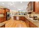 Spacious kitchen featuring custom cabinets, stainless steel appliances, and granite countertops at 8032 Banks Mill Rd, Douglasville, GA 30135