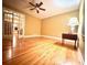 Spacious living room with hardwood floors, French doors, and ample natural light at 8032 Banks Mill Rd, Douglasville, GA 30135