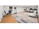 Spacious basement featuring an exercise area and a stylish marble-patterned rug on hardwood flooring at 2180 Dunwoody Heritage Dr, Atlanta, GA 30350