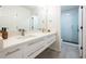 Modern bathroom with double sinks, a stylish vanity, and a glass-enclosed shower with sleek hardware at 2180 Dunwoody Heritage Dr, Atlanta, GA 30350