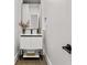 Modern bathroom vanity with a black framed mirror and neutral color palette at 2180 Dunwoody Heritage Dr, Atlanta, GA 30350