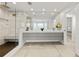 Elegant bathroom featuring a double vanity, large mirror, and a glass-enclosed shower with built-in bench at 2180 Dunwoody Heritage Dr, Atlanta, GA 30350