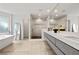 Bright bathroom with modern vanity, marble walk-in shower, soaking tub under a large window, and contemporary mirrors at 2180 Dunwoody Heritage Dr, Atlanta, GA 30350