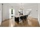 Dining room with large windows, modern lighting, and wood floors at 2180 Dunwoody Heritage Dr, Atlanta, GA 30350