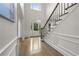 Grand foyer featuring high ceilings, staircase with wooden railing and hardwood floors at 2180 Dunwoody Heritage Dr, Atlanta, GA 30350