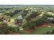 Scenic aerial view of the golf course featuring lush green fairways, water features, and mature trees at 2180 Dunwoody Heritage Dr, Atlanta, GA 30350