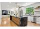 Modern kitchen features a large island and stainless steel appliances at 2180 Dunwoody Heritage Dr, Atlanta, GA 30350