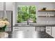 Modern kitchen featuring stainless steel appliances, sleek cabinetry, and an undermount sink at 2180 Dunwoody Heritage Dr, Atlanta, GA 30350