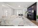 Spacious living room boasting a cozy fireplace, dark accent wall, and a stylish neutral color palette at 2180 Dunwoody Heritage Dr, Atlanta, GA 30350