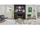 Modern living room features a black fireplace, neutral furniture, and stylish decor at 2180 Dunwoody Heritage Dr, Atlanta, GA 30350