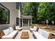 Inviting outdoor patio featuring comfortable seating and lush greenery for relaxation at 2180 Dunwoody Heritage Dr, Atlanta, GA 30350