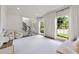 Well-lit playroom featuring large windows, hardwood floors, and an open floor plan at 2180 Dunwoody Heritage Dr, Atlanta, GA 30350