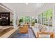 Bright sunroom featuring large windows, comfortable seating, and seamless indoor/outdoor flow at 2180 Dunwoody Heritage Dr, Atlanta, GA 30350
