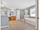 Expansive primary bathroom suite featuring dual sinks, walk-in shower, and a soaking tub under a window at 221 Hampton Station Blvd, Canton, GA 30115
