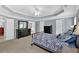 Primary bedroom featuring a tray ceiling with plenty of space and access to the bathroom at 221 Hampton Station Blvd, Canton, GA 30115