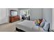 Bedroom featuring a large dresser, desk, and plentiful natural light from the large window at 221 Hampton Station Blvd, Canton, GA 30115