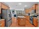 Well-equipped kitchen featuring stainless steel appliances, a center island, and plenty of cabinet space at 221 Hampton Station Blvd, Canton, GA 30115