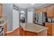 Modern kitchen with granite countertops, stainless steel appliances, and a central island for cooking at 221 Hampton Station Blvd, Canton, GA 30115