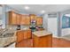 Functional kitchen showcasing granite countertops, wooden cabinets, and stainless steel appliances at 221 Hampton Station Blvd, Canton, GA 30115