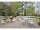 Relaxing backyard deck with seating, grill, and lush greenery, creating a serene outdoor retreat at 2410 Bankstone Sw Dr, Marietta, GA 30064