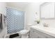 Well-lit bathroom with shower and tub combination and a vanity at 2410 Bankstone Sw Dr, Marietta, GA 30064