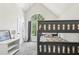 Bedroom with a bunk bed, dresser, and a large arched window at 2410 Bankstone Sw Dr, Marietta, GA 30064