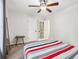Bedroom with carpet, bedside table, and a large mirror at 2410 Bankstone Sw Dr, Marietta, GA 30064