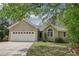 Charming single-story home with a two-car garage and well-maintained lawn at 2410 Bankstone Sw Dr, Marietta, GA 30064