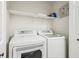 Bright laundry room featuring a modern washer and dryer set, maximizing efficiency and convenience at 2410 Bankstone Sw Dr, Marietta, GA 30064