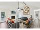 Bright living room featuring a fireplace, ceiling fan and modern decor at 2410 Bankstone Sw Dr, Marietta, GA 30064