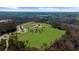 Aerial shot of the community baseball field surrounded by trees and greenery at 3239 Bartee Walk, Suwanee, GA 30024